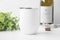 Blank white wine tumbler mockup with greenery, wine bottle , bottle opener and wine bottle cork.