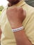 Blank white wristband on hand in hand
