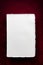 Blank White Writing Paper over Rich Red Background