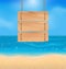 Blank wooden sign on beach, natural seascape