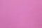 The blanket of furry pink fleece fabric. A background texture of light pink soft plush fleece material