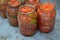 Blanks for the winter. Grated carrot, Red and yellow tomatoes in jars