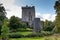 Blarney Castle, a medieval stronghold in Blarney, near Cork, Ireland, and the River Martin