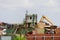 Blaydon UK: May 2022: Scrapyard. Machinery processing piles of scrap metal in a junkyard
