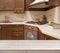 Bleached table on defocused brown kitchen interior background