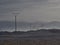 A bleak twilight paysage of a turkish province with power poles and the mountains sillhouettes