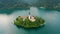 Bled, Slovenia - 4K aerial drone footage of flying away from Pilgrimage Church of the Assumption of Maria at Lake Bled