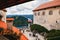 Bled, Slovenia - September, 8 2018: View of the The Bled Castle courtyard full with people, tower and castle buildings with cafes