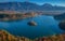 Bled, Slovenia - Sunrise at lake Bled taken from Osojnica viewpoint with traditional Pletna boats and Bled Castle