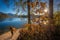 Bled, Slovenia - Tourist on the move on pier next to Lake Bled on a beautiful autumn sunrise