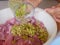 Blended food ingredients being poured on to pork slices for cooking a homemade recipe