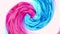 Blended pink and blue ink in the background of water on a white background, while creating beautiful swirl shapes.