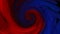 Blended red and blue ink in the background of water on a black background, while creating beautiful swirl shapes.