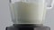 Blender whip fresh milk in super slow motion closeup. Dairy liquid swirling.