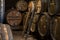 Blending process of cognac spirit and old French oak barrels in cellar in old distillery in Cognac white wine region, Charente,