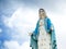 The Blessed Virgin Mary Statue blue sky background