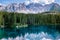 Bleu lake in the dolomites Italy, Carezza lake Lago di Carezza, Karersee with Mount Latemar, Bolzano province, South