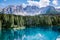 Bleu lake in the dolomites Italy, Carezza lake Lago di Carezza, Karersee with Mount Latemar, Bolzano province, South