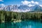 Bleu lake in the dolomites Italy, Carezza lake Lago di Carezza, Karersee with Mount Latemar, Bolzano province, South