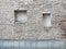 Blind curved basement windows in the old aged red bricks house