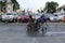 Blind man pushing wheelchair of disabled beggar