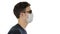 Blind man walking in medical mask and dark glasses on white background.