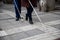 Blind man and woman walking on the street