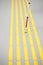 Blind pedestrian walking on tactile paving