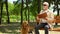 Blind pensioner with dog enjoying rest in park, social protection for impaired