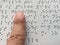 Blind person reads braille alphabet text