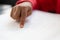 Blind schoolboy hand reading a braille book in classroom