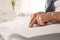 Blind senior person reading book written in Braille, closeup