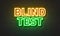 Blind test neon sign on brick wall background.