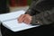 Blinded man reading by touching braille book