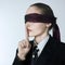 Blindfold business woman silence