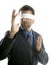 Blindfolded businessman over white background