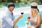 Blindfolded couple holding red wine