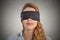 Blindfolded red haired woman