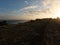 Blinding effect at sunset with blue sky and clouds in Leucate