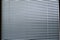 Blinds, texture blinds. Texture blinds office. White closed jalousie at day illumination. Blinds plastic texture background
