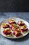 Blinis with creamy beetroot, goat cheese and hot smoked salmon