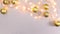 Blinking Christmas lights and gold Christmas ornaments on silver theme. Stop motion