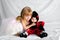 Blissfilled Sister Hugs Her Younger Sister Dressed as a Ladybug