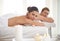 Blissful honeymoon pampering. A happy couple relaxing together at a spa.