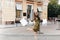 Blissful shopaholic woman dancing on the street with smile. Outdoor full-length portrait of slim fashionista girl in