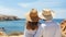 Blissful unrecognizable couple embracing the beauty of a bright summer day at the beach