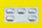 Blister or pack of five tablets or pills. The concept of five working days. Yellow background