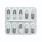 Blister pack of gray and white capsules isolated on white