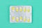 Blister or pack of ten medical tablets or pills. Turquoise classic medical background