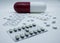 Blisters, medicine pill and capsule packs. Large white and red capsule.  on white background.